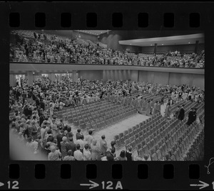 Graduates entering during Boston University summer commencement exercises at the War Memorial Auditorium