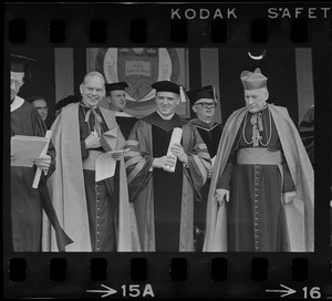 Terence Cardinal Cooke of New York, left, Boston College President W. Sevey Joyce, middle, and Richard Cardinal Cushing, right, on stage at Boston College commencement exercises