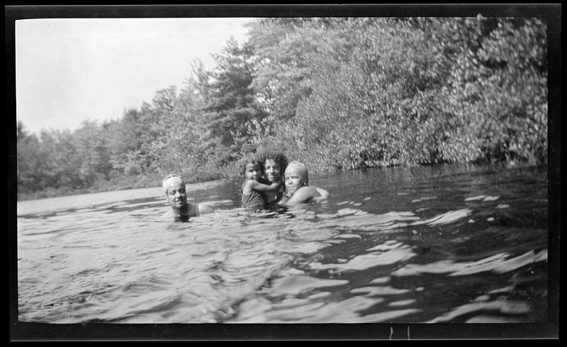 Four people swimming