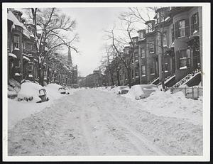 Street's Clear but it will be some time apparently before these cars will be able to use it. Photo was taken on West Concord St., South End, while Boston struggled to dig itself out.