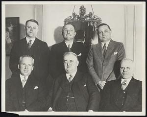 Meet to "Save the Minors". The Minor League baseball's "committee of five". With Billy Evans, general manager of the Cleveland Indians, acting as Major League "cooperator", met at Louisville, KY., Jan. 10 in first of series of meetings designed to "save the minors", organization of New Leagues. Plans for the financial betterment of small leagues and increased attendance were the topics. Left to right, standing: Ross Harriott, pres. Terre Haute, Ind., club; J. Alvin Gardner, president of Texas League; Billy Evans. Sitting, left to right: Warren Giles, president of Rochester, N.Y., club; W.G. Bramham, president of the Piedmont League and committee chairman, and Jos. Carr, secretary of the committee.