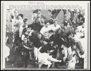 Everybody in New York loved the Mets 9/24 after they beat St. Louis and won the eastern division title in the National League. Winning pitcher Gary Gentry (C) is mobbed by wildly ecstatic fans after his 6-0 shutout.