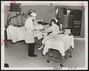 Mobile Field Hospital For Great Britain. New York City- Henry A. Rigg of Fairview, Conn., is shown undergoing a blood transfusion in the mobile field hospital which is to be presented to Great Britain for civilian use by the American Field Hospital Corps. This man is donating his blood for the British.