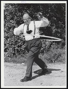 Don Carr, manager, F.W. Woolworth, Wollaston Branch, President Wollaston Businessmens’ Association, with hula hoop