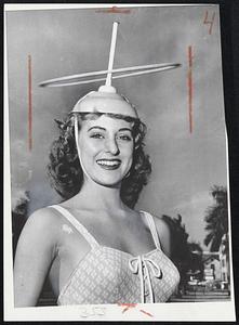Latest trend in hoop spinning is demonstrated by Sharalynn Cole in Miami, Fla.