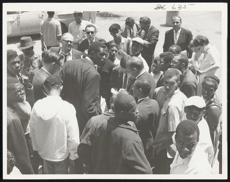 Bill Russell talks to newsman at St. March's Church.