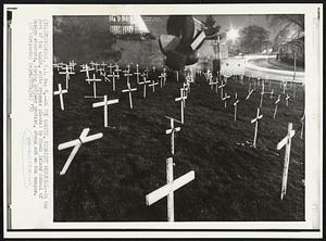 On the Campus, Midnight Memorial -- In the dark of the night, white crosses planted by Rhode Island School of Design students, during antiwar protest, stand out on the campus.
