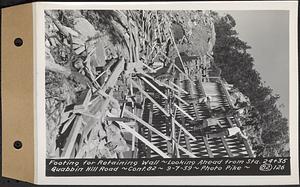 Contract No. 82, Constructing Quabbin Hill Road, Ware, footing for retaining wall, looking ahead from Sta. 24+35, Ware, Mass., Sep. 7, 1939