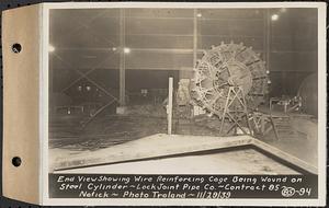 Contract No. 85, Manufacture and Delivery of Precast Concrete Steel Cylinder Pipe, Southborough, Framingham, Wayland, Natick, Weston, end view showing wire reinforcing cage being wound on steel cylinder, Natick, Mass., Nov. 29, 1939