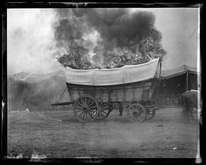 Covered wagon on fire