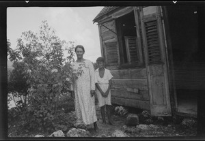 Mrs. King, a descendent of one of the Cromwell exiles, at the door of her house at Bathsheba, Barbados, B. W. Indies