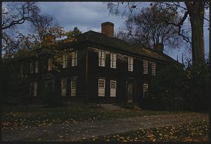 Autumn scene of house with dark exterior