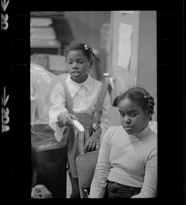 Black schoolchildren play recorders, Roxbury