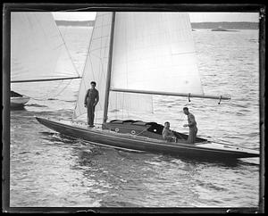 Three people in an unidentified yacht