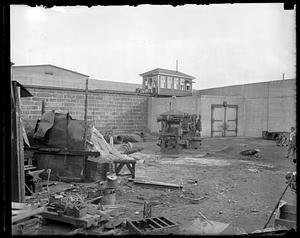 A outdoor space filled with debris and building materials