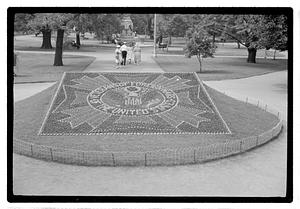 Veterans of Foreign Wars of the United States logo floral design in front of Ether Monument, Public Garden