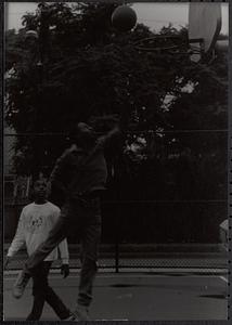 Donovan Thomas and Omo Moses playing basketball