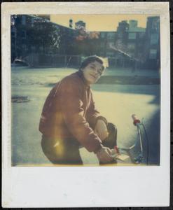 Val posing on a bicycle