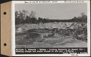 William C. Edwards, looking easterly in gravel pit, showing stumps and roots stored in old pit, Oakham, Mass., May 16, 1941