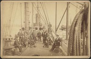 Fifteen unidentified men on the deck of a ship
