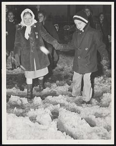 Chivalry Still Lives--David Hartl assists Phyllis Fewtrell across Tremont street on their way home from school in the South End yesterday.