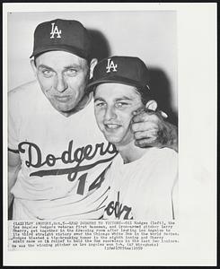 Lead Dodgers to Victory--Gil Hodges (left), the Los Angeles Dodgers veteran first baseman, and iron-armed pitcher Larry Sherry, get together in the dressing room after leading Los Angeles to its third straight victory over the Chicago White Sox in the World Series. Hodges blasted a tie-breaking homer in the eight inning and Sherry again came on in relief to hold the Sox scoreless in the last two innings. He was the winning pitcher as Los Angeles won 5-4.