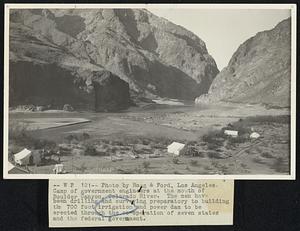 Camp of government engineers at the mouth of Boulder Canyon, Colorado River. The men have been drilling and surveying preparatory to building the 700 foot irrigation and power dam to be erected through the co-operation of seven states and the federal government.