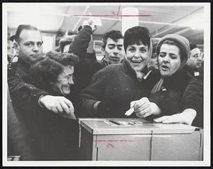 Jubilant Raytheon workers cast their ballots at Suffolk Downs union meeting which resulted in termination of strike against the company.