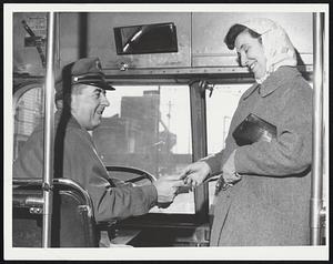 First passenger on bus at Everett M.T.A. Bus, 2:45. Bus driver Thomas F. Craven of Medford. Mrs. Lawrence Malatesta of Malden.