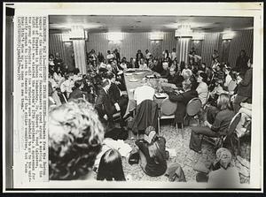 Students Invade Meeting--Students from the Boston campus of the University of Massachusetts crowd around a meeting of the Board of Trustees in Boston Wednesday. Dr. Robert C. Wood (glasses, right on the table) was elected the system's 17th president. A spokesman for the group of students said the trustees were scheduled to go to the university campus to listen to demands of the strike committee, but "when they didn't show up, we came to see them."