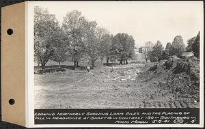 Contract No. 130, Grading, Loaming, and Grassing Vicinity of Shaft 4, Pressure Aqueduct, Southborough, and Improvement of Access Roads to the Intake Works and at Norumbega Reservoir, Marlborough, Southborough, Weston, looking northerly showing loam piles and the placing of fill, headhouse at Shaft 4, Southborough, Mass., May 6, 1941