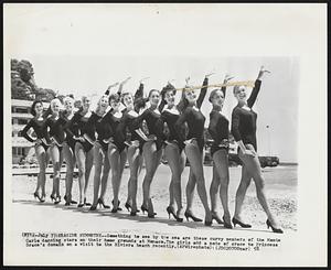 Seaside Symmetry--Something to see by the sea are these curvy members of the Monte Carlo dancing stars on their home grounds at Monaco. The girls add a note of grace to Princess Grace's domain on a visit to the Riviera beach recently.
