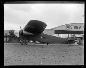 Byrd's South Pole plane before they put pontoons on it. East Boston Airport. B.A.C. hangar in back, a Fokker trimotor plane