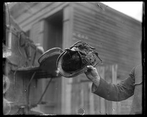 Damaged equipment, possibly a firefighter's helmet damaged in a fire