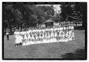 Group holding circular emblems