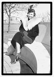 A model posing by the Oliver Wendall Holmes Memorial Sundial