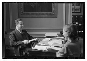 A man seated at a desk
