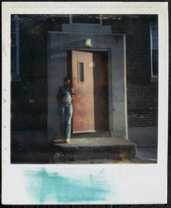 Young woman standing in front of a door, Newtowne Court