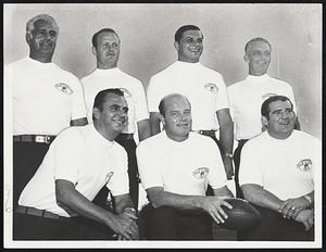 Pats Bosses - Virtually new coaching staff of Boston Patriots lines up at Umass. Left to right, front, Johnny Mazur; Head Coach Clive Rush; Jesse Richardson. Rear, left to right, Bill Elias, Jerry Stoltz, John Meyer and Bruce Beatty. Richardson is only holdover from staff of departed Mike Holovak.