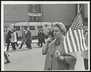 A woman holding an American flag