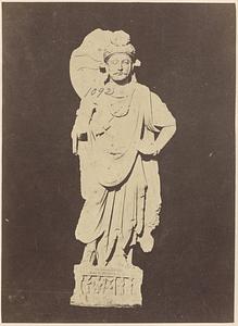 Sculpture on man in toga-like garment