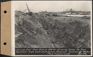 Contract No. 80, High Level Distribution Reservoir, Weston, looking east from Sta. 883+10+/- showing forms for twin aqueduct, high level distribution reservoir, Weston, Mass., Mar. 20, 1940