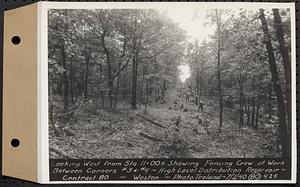 Contract No. 80, High Level Distribution Reservoir, Weston, looking west from Sta. 11+00+/- showing fencing crew at work between corners 3 and 4, high level distribution reservoir, Weston, Mass., Jul. 2, 1940