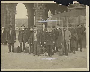 Photo of--I.W.W. Members Freed After 18 Months Detention. News Item--Here we have some of the members of the I.W.W. who were released from Ellis Island to-day, where they had been awaiting deportation to their native lands. The "undesireables" have spent 18 months in jails throughout the country.