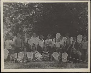Campers at Moose Hill Audubon Sanctuary day camp, shown holding butterfly nets