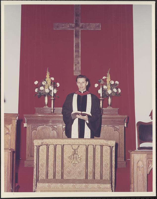 Clergyman in robes at altar