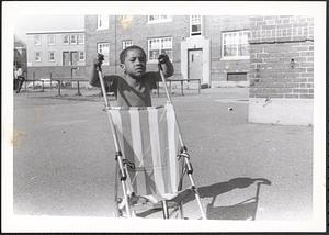 Jared pushing a stroller in Newtowne Court