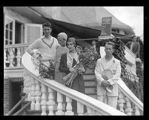 Wilmer Allison and John Van Ryn with two women holding flowers, Longwood Cricket Club