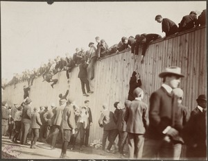 Fans scaling the wall at the Huntington Avenue Grounds, 1903 World Series