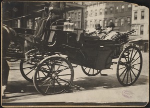 Two men in a landau carriage